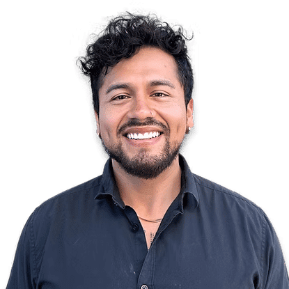Portrait of Miguel, a professional stylist at Headlines The Salon, showcasing their expertise and style.