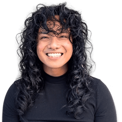 Portrait of June, a professional stylist at Headlines The Salon, showcasing their expertise and style.