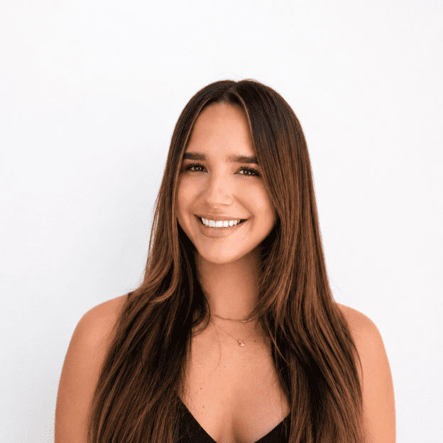 Portrait of Emmy, a professional stylist at Headlines The Salon, showcasing their expertise and style.